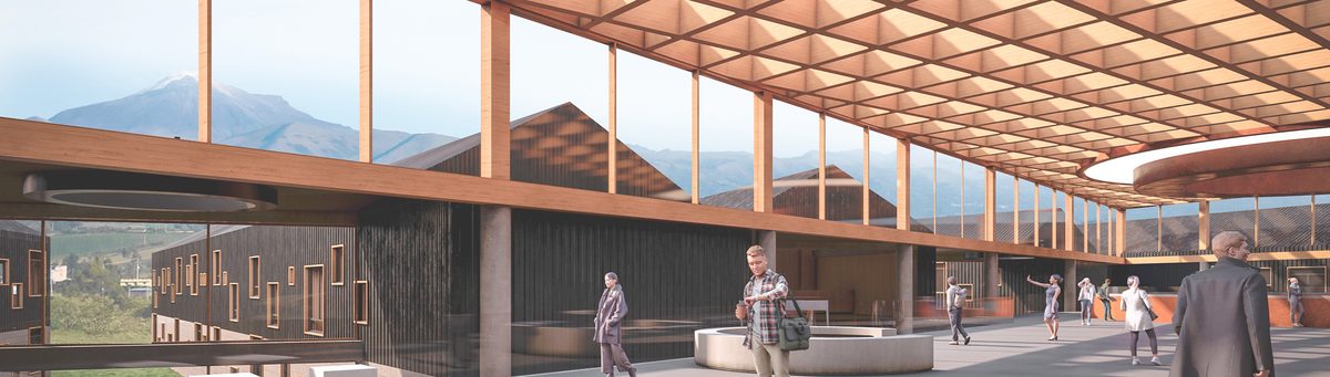 Galería interior de la sede SENA Casa Grande con cubierta de madera y el volcán al fondo
